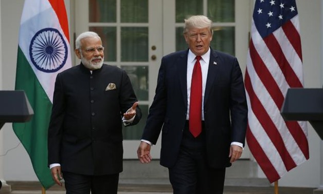 FILE PHOTO: U.S. President Donald Trump (R) arrives for a joint news conference with Indian Prime Minister Narendra Modi in the Rose Garden of the White House in Washington, U.S., June 26, 2017. REUTERS/Kevin Lamarque
