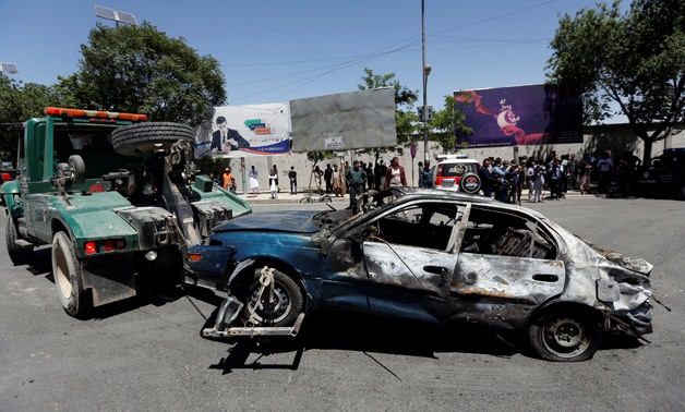 A damaged car is moved away after a blast in Kabul, Afghanistan May 31, 2017. REUTERS/Mohammad Ismail