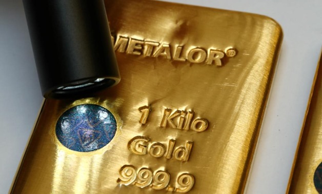 FILE PHOTO: The Sicpa Oasis validator system (bullion protect) is pictured on one kilogram bar of gold at Swiss refiner Metalor in Marin near Neuchatel, Switzerland July 5, 2019. REUTERS/Denis Balibouse
