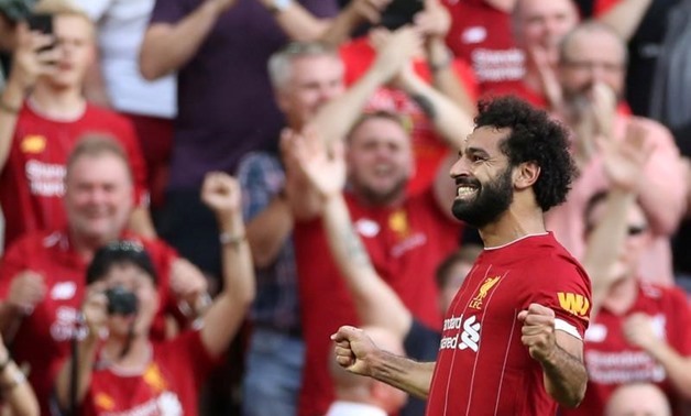Liverpool's Mohamed Salah celebrates scoring their third goal. Reuters/Carl Recine

