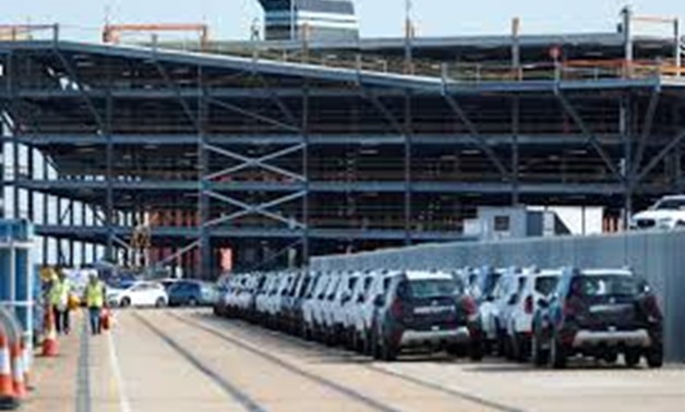 FILE PHOTO: Cars readied for export are parked next to a vehicle storage facility on the dockside at the ABP port in Southampton, Britain August 16, 2017. REUTERS/Peter Nicholls
