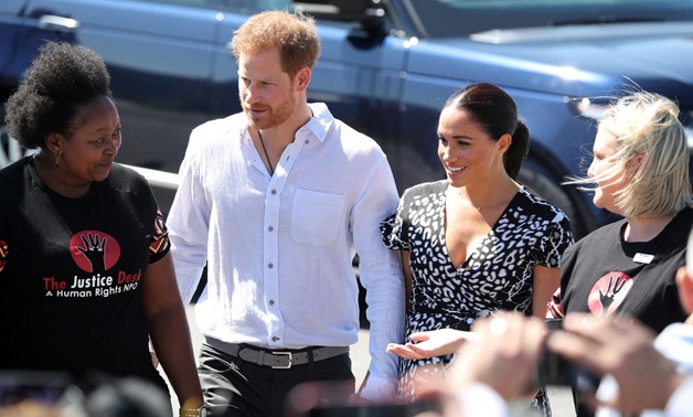 The Duke and Duchess of Sussex, Prince Harry and his wife Meghan, are welcomed to a Justice Desk initiative in Nyanga township, on the first day of their African tour in Cape Town, South Africa, September 23, 2019. REUTERS/Mike Hutchings
