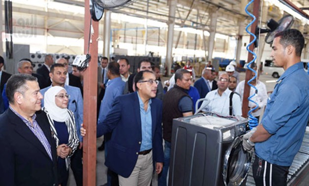 Prime Minister Mustafa Madbouli during his visit to El Araby Group factories complex in the industrial zone in the Upper Egypt governorate of Beni Suef - Press Photo
