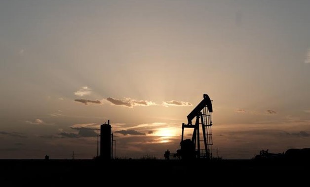 FILE PHOTO: Oil pump jacks work at sunset near Midland, Texas, U.S., August 21, 2019. REUTERS/Jessica Lutz/File Photo
