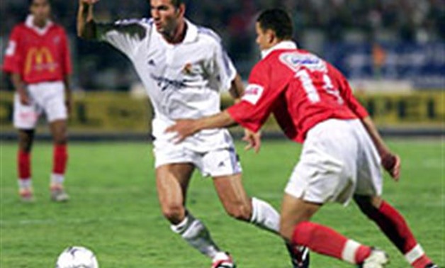 File- Zidane and Hossam Ghaly during the game in 2001 