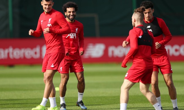 FILE PHOTO: Soccer Football - Champions League - Liverpool Training - Melwood, Liverpool, Britain - September 16, 2019 Liverpool's Mohamed Salah and Dejan Lovren during training Action Images via Reuters/Lee Smith/File Photo