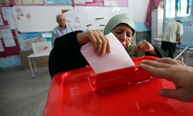 A woman casts her vote in a polling station during presidential election in Tunis, Tunisia, September 15, 2019. REUTERS/Muhammad Hamed
