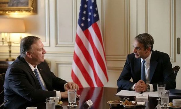 U.S. Secretary of State Mike Pompeo speaks with Greek Prime Minister Kyriakos Mitsotakis at the Maximos Mansion in Athens, Greece October 5, 2019. REUTERS/Costas Baltas/Pool
