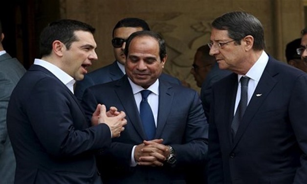 A file photo of Egyptian President Abdel Fattah al-Sisi (C), Cypriot President Nicos Anastasiades (R) and Greek Prime Minister Alexis Tsipras chatting outside the Presidential Palace in Nicosia, April 29, 2015. (Reuters)
