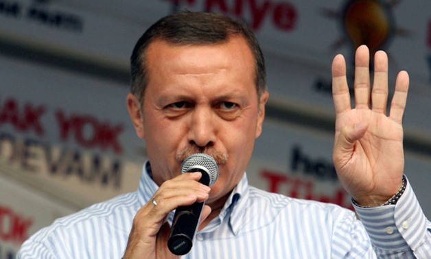 Turkey’s President Erdogan from the Islamist AK Party makes the Rabia sign of the Muslim Brotherhood (Photo: Reuters)