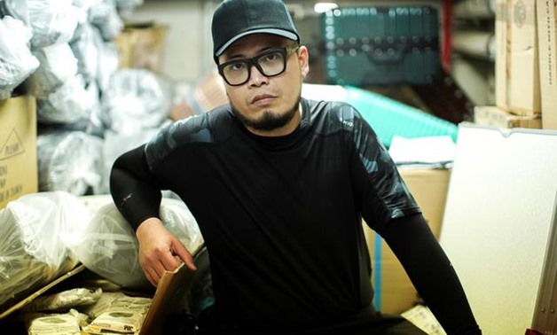 Keita Lee, 33, owner of the "National Calamity Hardware Store" poses at his shop in Hong Kong, China, September 27, 2019. REUTERS/Athit Perawongmetha
