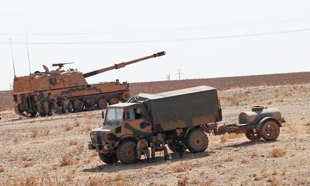 FILE PHOTO: Turkish army vehicles and military personnel are stationed near the Turkish-Syrian border in Sanliurfa province, Turkey, October 12, 2019. REUTERS/Murad Sezer