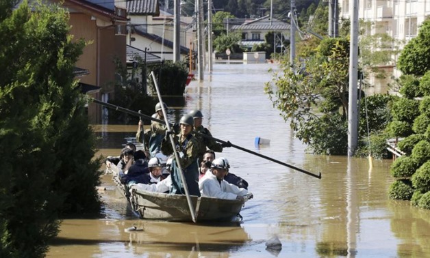 Local residents are rescued by Japapnese Defence-Force soldiers from a flooded area caused by Typhoon Hagibis in Kakuda, Miyagi prefecture, Japan, October 13, 2019, in this photo taken by Kyodo. Mandatory credit Kyodo/via REUTERS