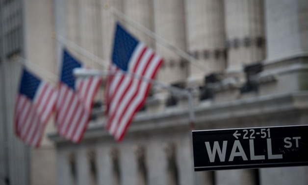 Wall Street stocks finished at records again Friday after a lacklustre US jobs report raised expectations the Federal Reserve could take a more gradual approach to increasing interest rates – AFP