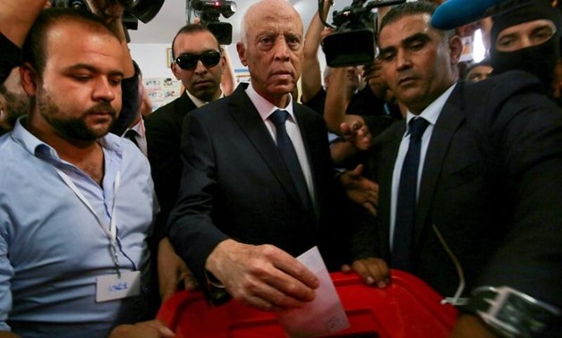 Tunisian presidential candidate Kais Saied casts his vote at a polling station during a second round runoff of a presidential election in Tunis, Tunisia October 13, 2019. REUTERS/Amine Ben Aziza