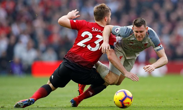 Soccer Football - Premier League - Manchester United v Liverpool - Old Trafford, Manchester, Britain - February 24, 2019 Liverpool's James Milner in action with Manchester United's Luke Shaw REUTERS/Phil Noble 