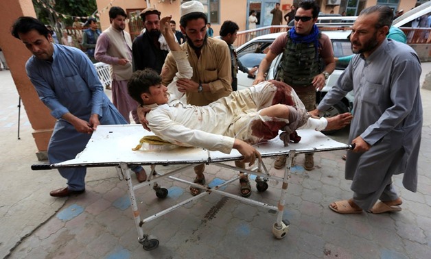 A wounded man after a bomb blast at a mosque in in Nangarhar Province, Afghanistan, on Friday.CreditCreditParwiz/Reuters