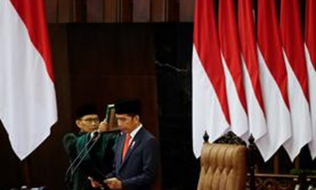 Indonesian President Joko Widodo is sworn in during his presidential inauguration for the second term, at the House of Representatives building in Jakarta, Indonesia, October 20, 2019. Adi Weda/Pool via REUTERS
