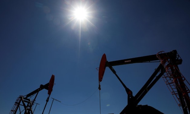 FILE PHOTO: Oil rigs are seen at Vaca Muerta shale oil and gas drilling, in the Patagonian province of Neuquen, Argentina January 21, 2019. REUTERS/Agustin Marcarian
