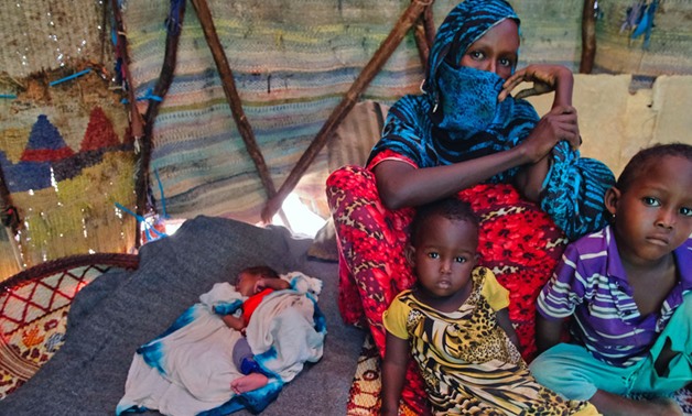 Farhia Mousa sits with three of her six children, including Nacima, 10-days-old, Abdulahi, 4-years-old, and Nasterha, 2-years-old, in a camp for people displaced by conflict and drought in Dangaroyo, Somalia. (22 May 2019) - UNICEF 