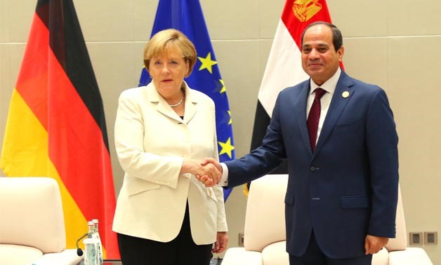 President Sisi (R) meets with Angela Merkel (L) in Berlin in 2015 - Press Photo