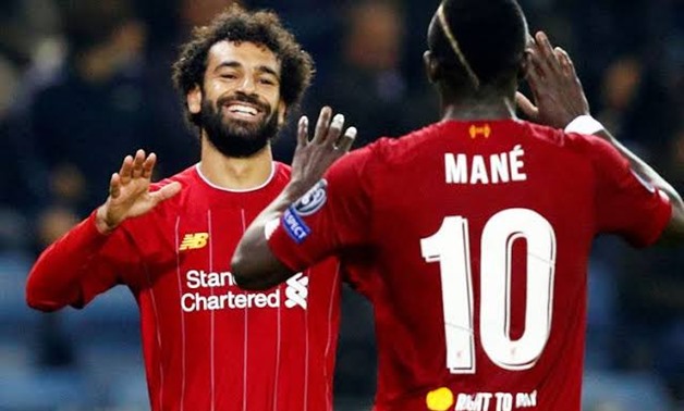 Liverpool's Mohamed Salah celebrates scoring their fourth goal with teammate Sadio Mane, Reuters