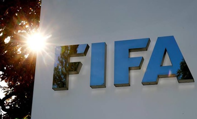 File PHOTO: The logo of FIFA is seen in front of its headquarters in Zurich, Switzerland September 26, 2017. REUTERS/Arnd Wiegmann/File Photo 