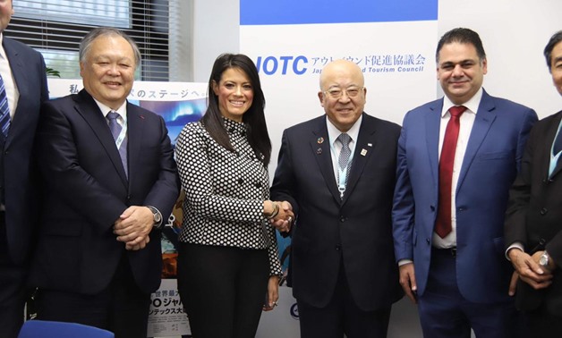 FILE: Tourism Minister Rania al-Mashat shakes hands with Chairman of the Japan Association of Travel Agents (JATA) Hiromi Tagawa during her participation in the Tourism Expo Japan 2019