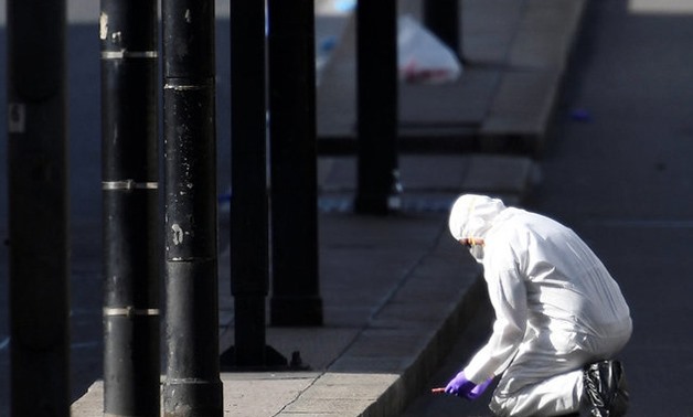 A police forensics investigator works on London Bridge after an attack left 6 people dead and dozens injured in London, Britain, June 4, 2017 -  REUTERS