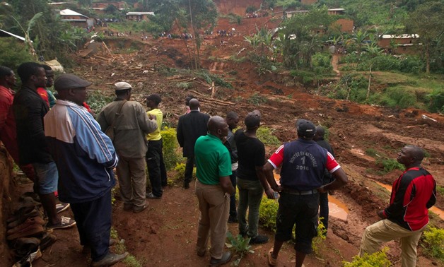 People gather at the site of a landslide caused by heavy rains in the town of Bafoussam in the western highlands, Cameroon October 30, 2019. REUTERS/Stringer
