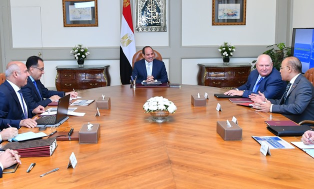 President Abdel Fattah El Sisi meets with CEO of US Progress Rail Locomotives (PRL) William Petersons and other Egyptian ministers in Cairo on Saturday- Press photo.