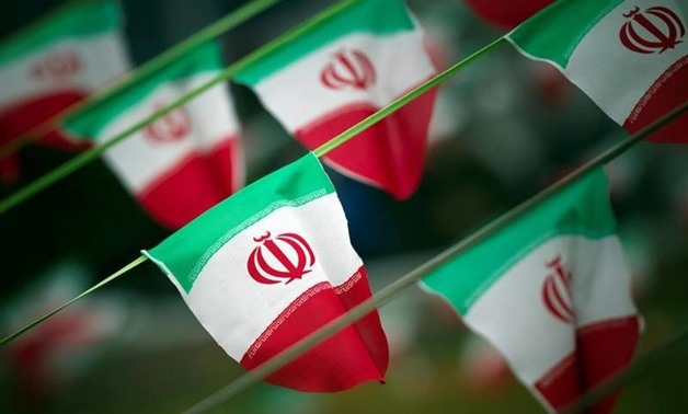 FILE PHOTO: Iran's national flags are seen on a square in Tehran February 10, 2012, a day before the anniversary of the Islamic Revolution. REUTERS/Morteza Nikoubazl
