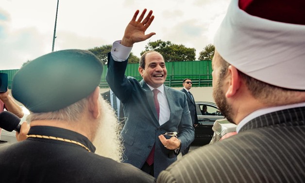 File- Egyptian President Abdel Fatah al Sisi saluting Egyptians at the Cairo International Airport