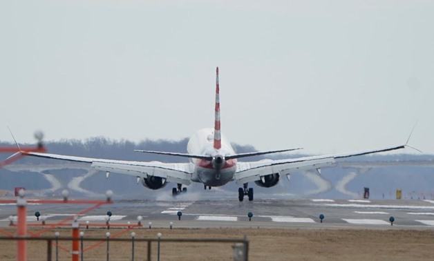 FILE PHOTO: An American Airlines Boeing 737 MAX 8 flight from Los Angeles lands at Reagan National Airport shortly after an announcement was made by the FAA that the planes were being grounded by the United States in Washington, U.S. March 13, 2019. REUTE