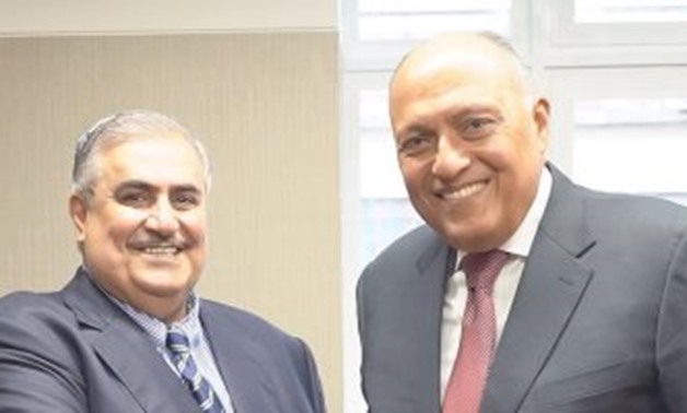 Egyptian Foreign Minister Sameh Shoukry with his Bahraini counterpart Sheikh Khalid bin Ahmed Al-Khalifa on the sidelines of the UN General Assembly meetings in New York City - Press Photo
