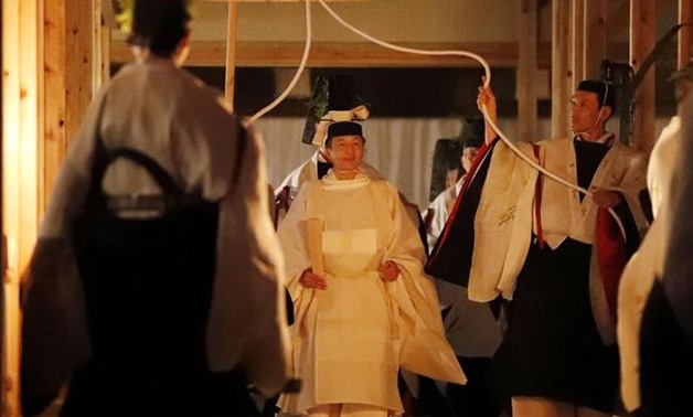 Japan's Emperor Naruhito walks to Yukiden to attend 'Daijosai', the most overtly religious ceremony of the emperor's accession rituals, at the Imperial Palace in Tokyo, Japan, November 14, 2019, in this photo released by Kyodo. Mandatory credit Kyodo/via 