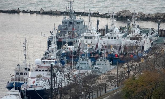 Seized Ukrainian naval ships are guarded by Russia's Coast Guard vessels in the port in Kerch, near the bridge connecting the Russian mainland with the Crimean Peninsula, Crimea November 17, 2019. REUTERS/Alla Dmitrieva