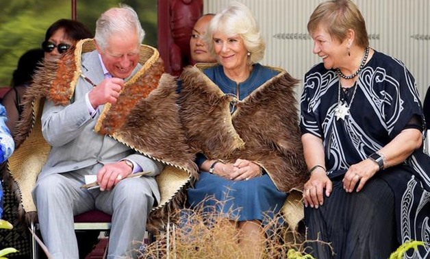 Prince Charles and his wife Camilla, the Duchess of Cornwall wear traditional cloaks as Dame Nadia Galvish translates the local Chiefs' speeches during a visit to Waitangi Treaty Grounds in Waitangi, New Zealand November 20, 2019. REUTERS/Tracey Nearmy
