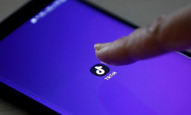 FILE PHOTO: The logo of the TikTok app is seen on a mobile phone screen in this picture illustration taken February 21, 2019. Picture taken February 21, 2019. REUTERS/Danish Siddiqui/Illustration

