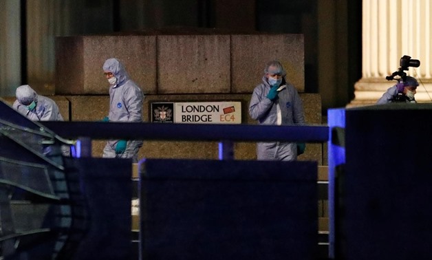 Forensics officers are seen near the site of an incident at London Bridge in London, Britain, November 29, 2019. REUTERS/Peter Nicholls
