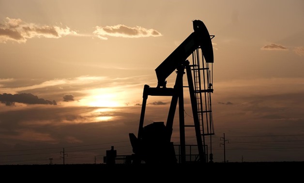 FILE PHOTO: Oil pump jacks at sunset near Midland, Texas, U.S., August 21, 2019. REUTERS/Jessica Lutz
