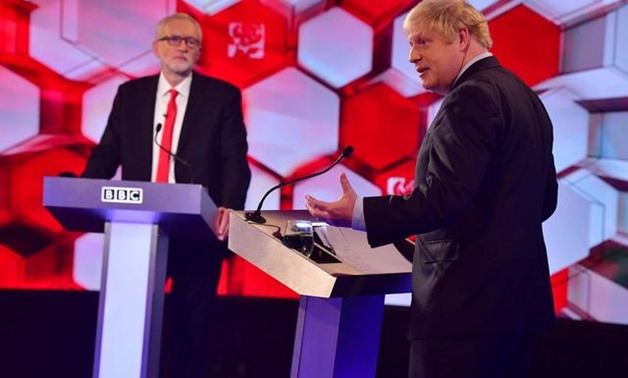 Britain's Prime Minister Boris Johnson and opposition Labour Party leader Jeremy Corbyn face each other in a head-to-head debate on the BBC in London, Britain December 6, 2019. Jeff Overs/BBC/Handout via REUTERS
