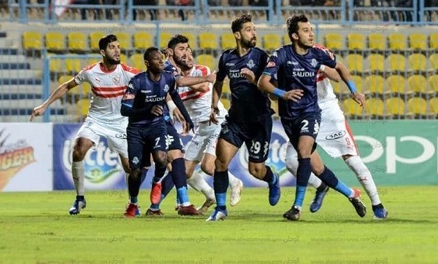 File-  players battle for the ball during a game between Zamalek and Pyramids last season 