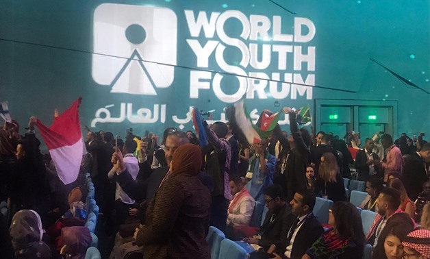Participants in WYF 2019 waving the flags of their countries in the opening ceremony held in Sharm El Sheikh on December 14, 2019. Egypt Today