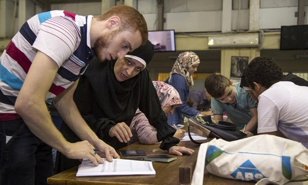 A Syrian refugee registers at UNHCR’s office in Cairo, Egypt, in September 2016. © UNHCR/Scott Nelson
