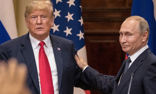 FILE: President Donald Trump and Russian President Vladimir Putin at their summit in Helsinki, Finland, in July. Chris McGrath/Getty Images