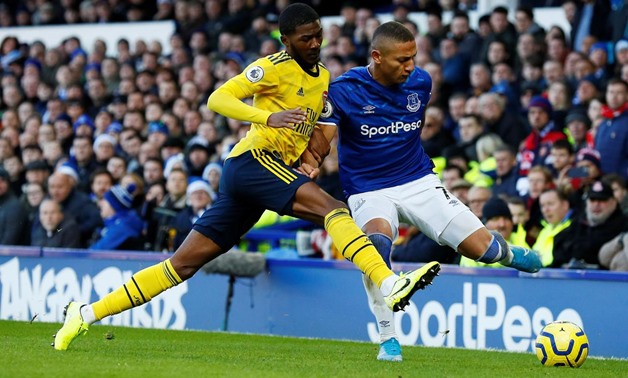 Soccer Football - Premier League - Everton v Arsenal - Goodison Park, Liverpool, Britain - December 21, 2019 Arsenal's Ainsley Maitland-Niles in action with Everton's Richarlison Action Images via Reuters/Jason Cairnduff