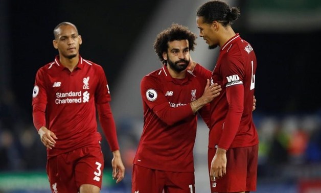 Liverpool's Mohamed Salah shakes hands with Virgil van Dijk at the end of the match. Action Images via Reuters/Carl Recine
