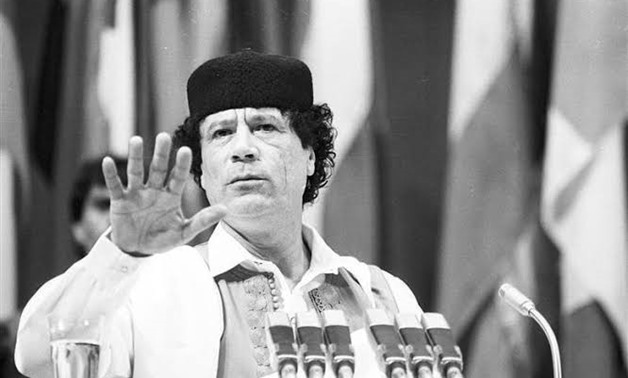 FILE - Libyan Leader Colonel Muammar Gaddafi holds out his hand during his speech at the Summit for the Non-aligned Countries in Belgrade, September 5, 1989. REUTERS/Stringer