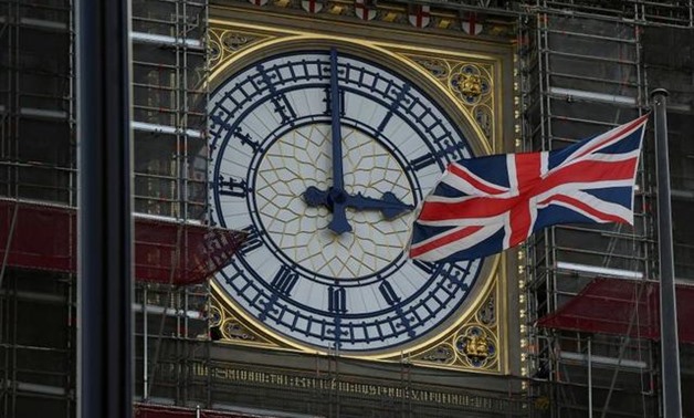 FILE PHOTO: British Union Jack flag flies in front of the clock face of Big Ben in London, Britain August 29, 2019. REUTERS/Toby Melville
